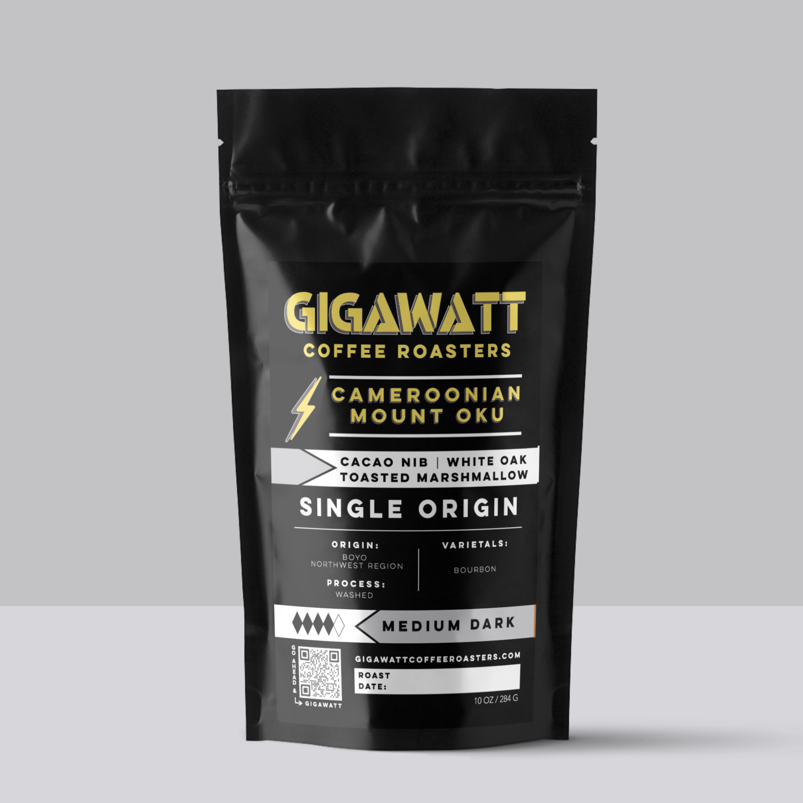 Gigawatt Coffee Cameroon, freshly roasted small batch, medium dark roast with smooth taste. Single origin from Boyo, Mount Oku, 10 oz, displayed on a counter.