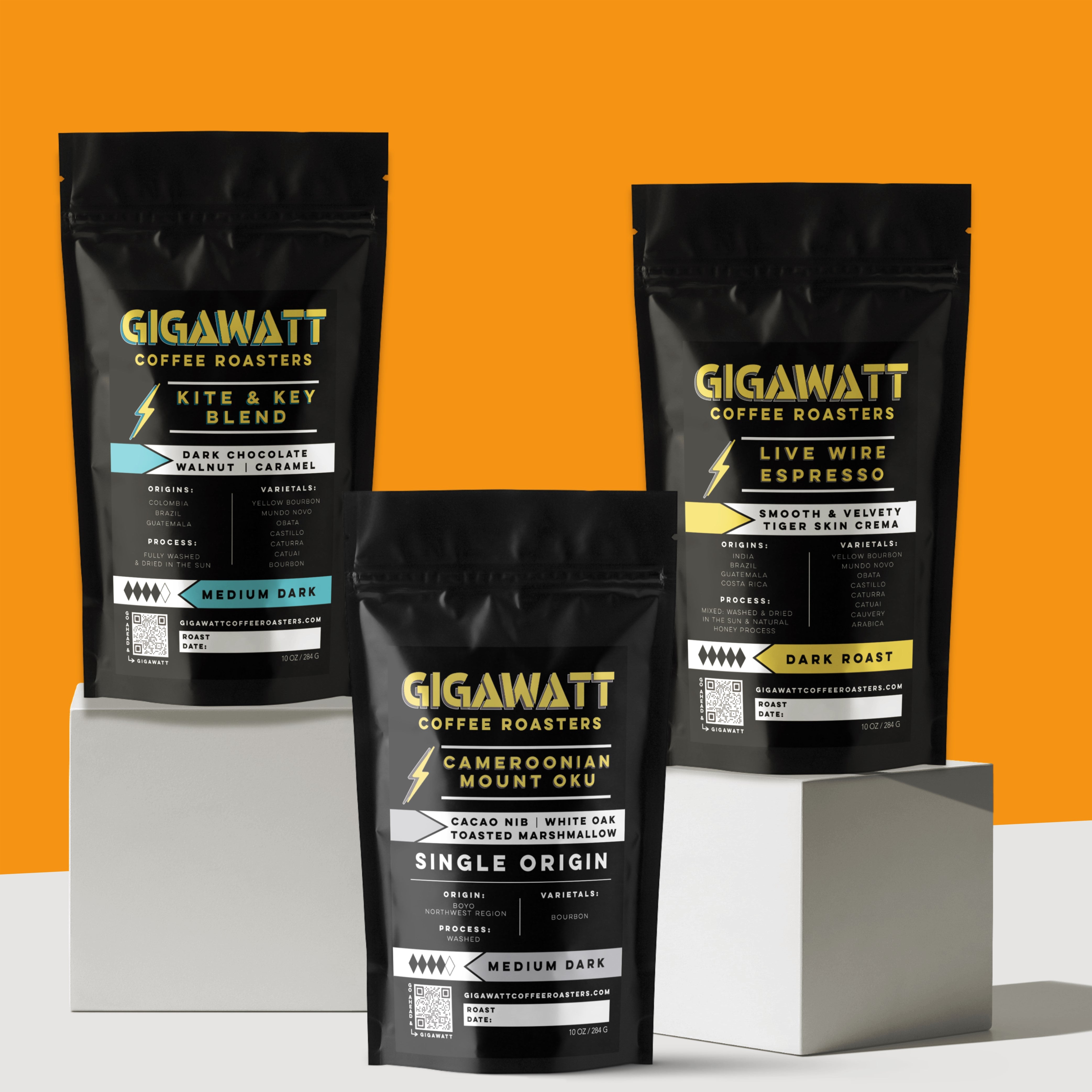 Gigawatt Coffee Dark Roast Coffee Sampler, featuring bestselling Live Wire Espresso Blend, Kite & Key Blend, and Cameroonian Mount Oku. A trio of dark roasts with smooth, well-balanced flavor. 10 oz bags.