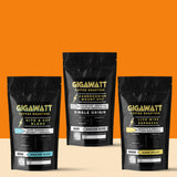 Gigawatt Coffee Dark Roast Coffee Sampler featuring bestselling Live Wire Espresso Blend, Kite & Key Blend, and Cameroonian Mount Oku. Smooth, balanced dark roasts with rich flavor. 10 oz bags, displayed on a counter.