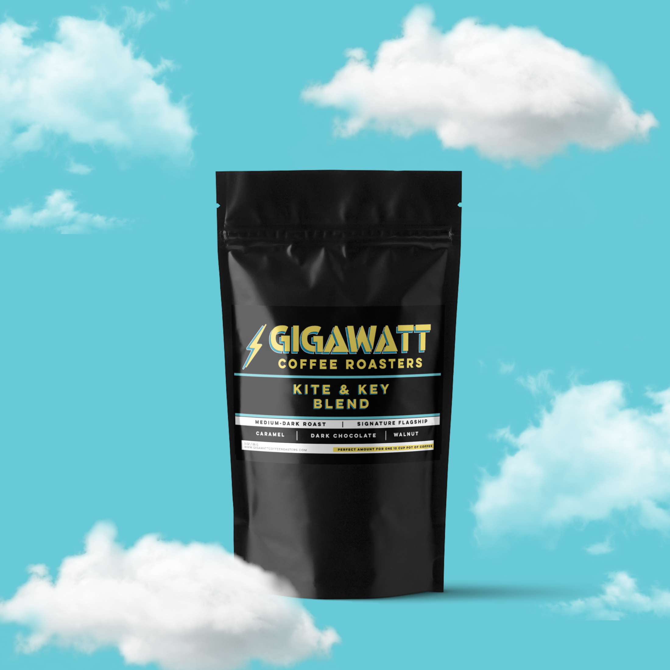 Gigawatt Coffee Kite & Key Blend, bestselling medium dark roast coffee blend. Smooth and balanced, ideal for coffee lovers. 3 oz coffee sampler pack, set against a cloud-filled background.