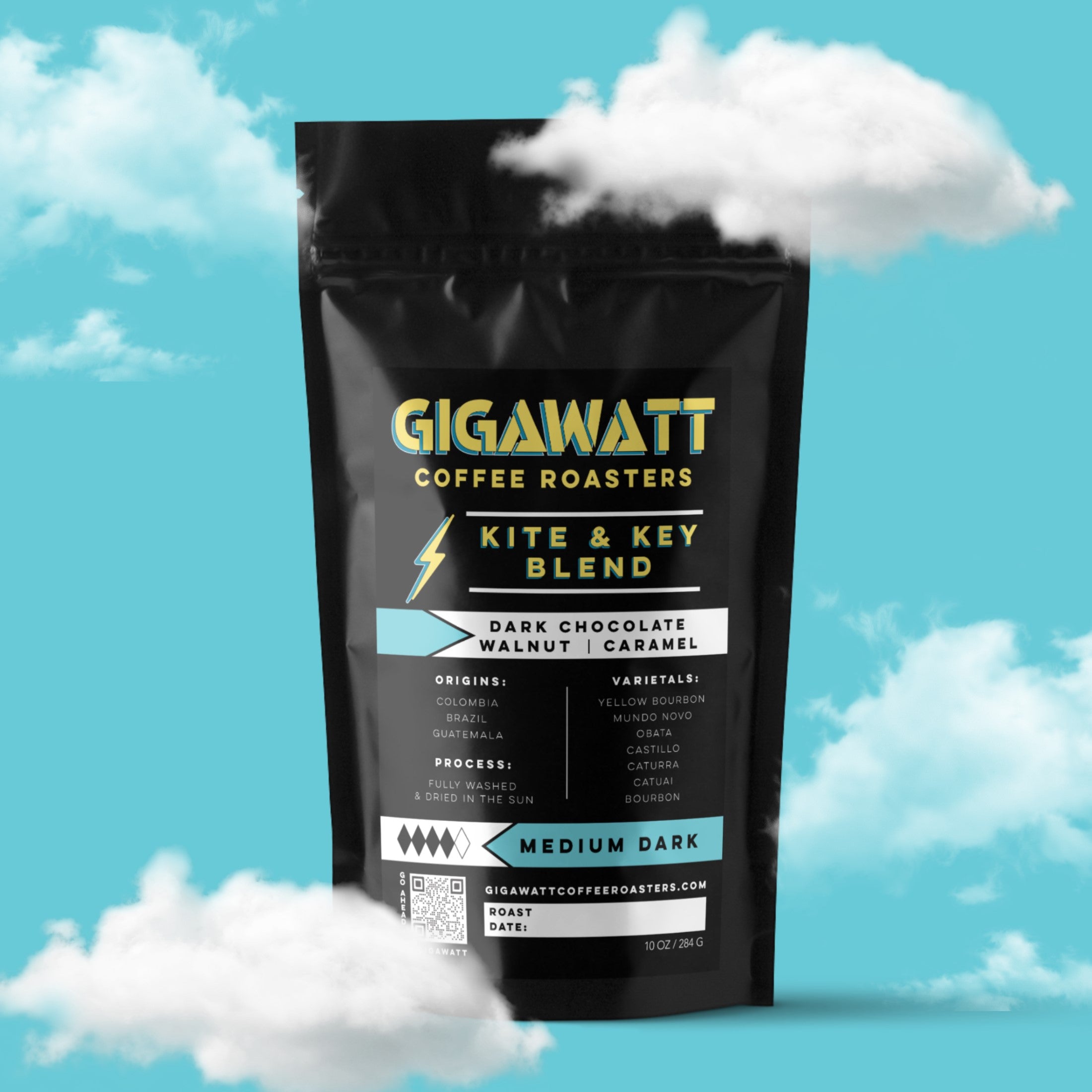 Gigawatt Coffee Kite & Key Blend, best-selling medium dark roast, freshly roasted small batch with smooth, well-balanced taste. 10 oz, set against a cloud-filled background.