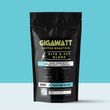 Gigawatt Coffee Kite & Key Blend, best-selling medium dark roast, freshly roasted small batch with smooth, well-balanced taste. 10 oz, displayed on a counter.