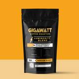 Gigawatt Coffee Luminosity Breakfast Blend Coffee, freshly roasted small batch medium roast with smooth taste. Breakfast blend coffee, 10 oz, displayed on a counter.