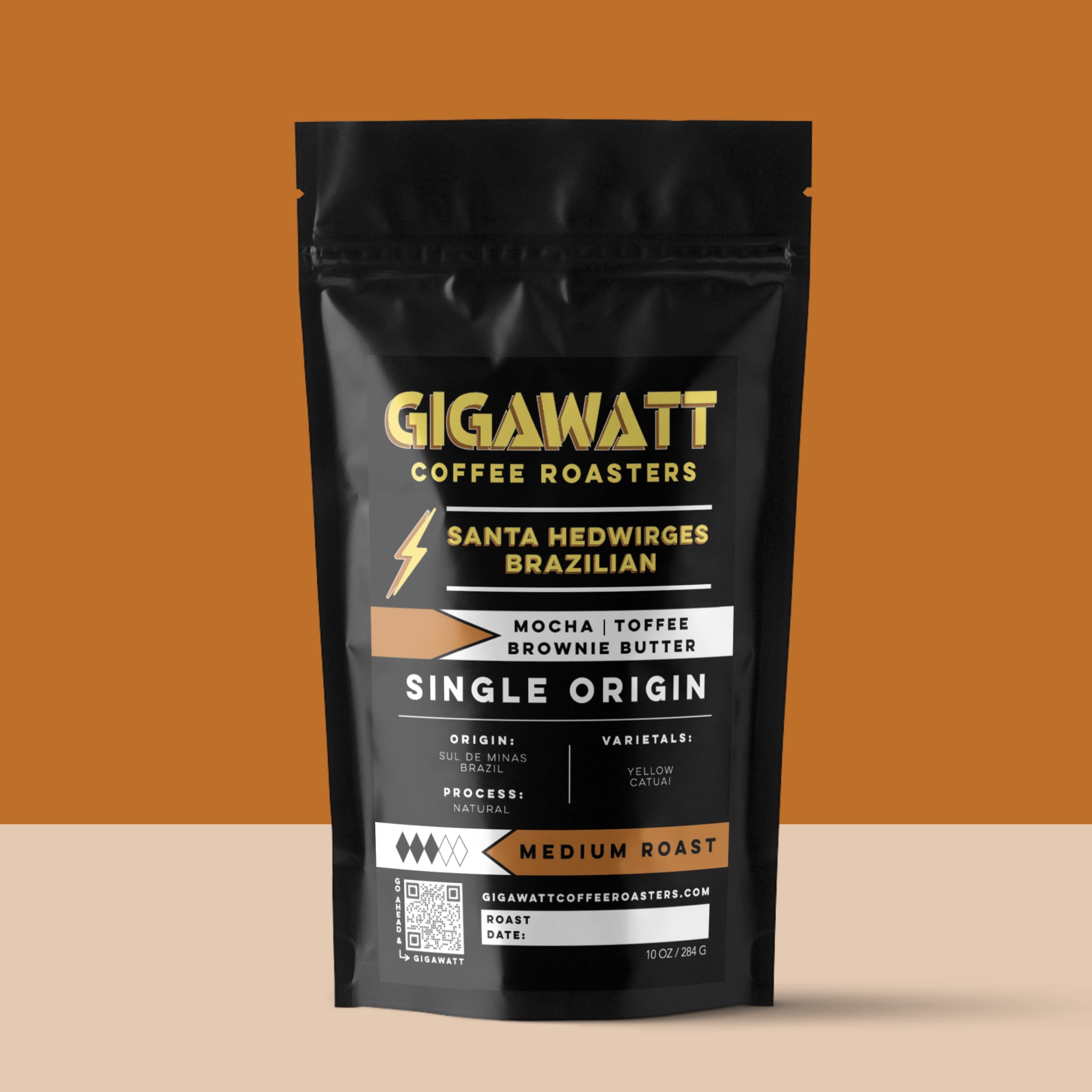 Gigawatt Coffee Santa Hedwirges Brazilian Coffee, freshly roasted small batch medium roast with smooth, well-rounded taste. Single origin from Brazil, 10 oz, displayed on a counter.