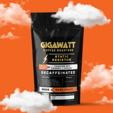 Gigawatt Coffee Static Resistor Decaf, water processed Colombian dark roast, freshly roasted small batch with smooth, full-bodied taste. Decaf coffee, 10 oz, set against a cloud-filled background.